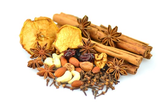 christmas spices, nuts and dried fruits isolated on white background