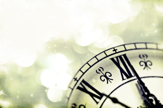 Vintage photo of old clock over holiday background