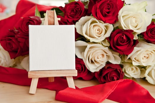 White and red roses with small canvas with text space
