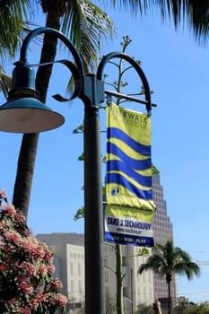 FORT LAUDERDALE, FLORIDA - FEBRUARY 3: Yellow and blue hanging banner showing the goriverwalk.com website and current events with live work play buzzwords February 3, 2013 in Ft Lauderdale, Florida.
