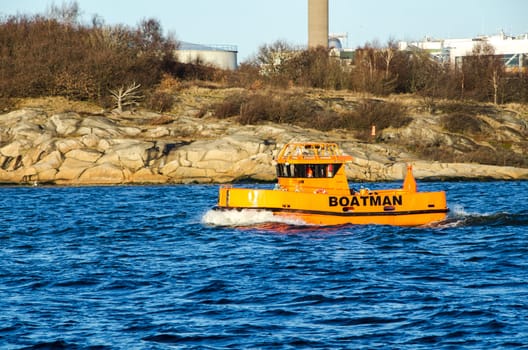 Workboat in Gothenburg harbor on a sunny autumn day