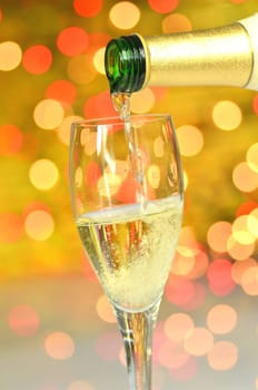 a glass of champagne against bokeh background
