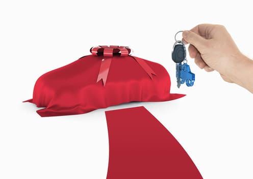 One hand holds the key of the new car. Red carpet for a special client.