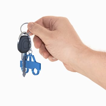 A hand giving the key of the new car.