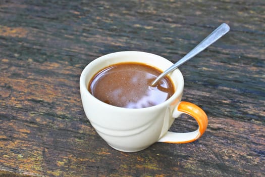 hot coffee in white cup on a wooden table, During leisure time