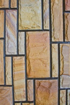 Textured stone wall in gaden at home, Thailand.
