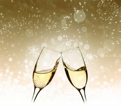 Glasses with champagne against fireworks
