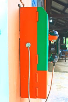 close up public telephone coin in Thailand