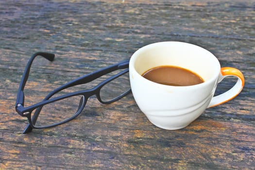 hot coffee in white cup on a wooden table, During leisure time