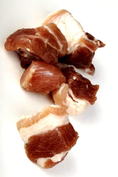 raw bacon in pieces