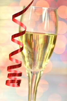 a glass of champagne against bokeh background