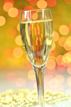a glass of champagne against bokeh background