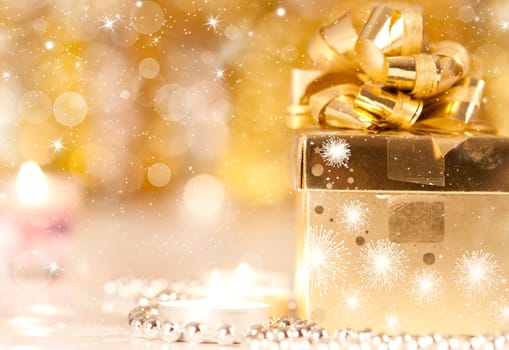 Gift box and candles and holiday lights