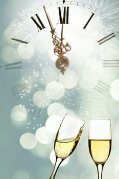 Glasses with champagne against holiday lights and clock close to midnight