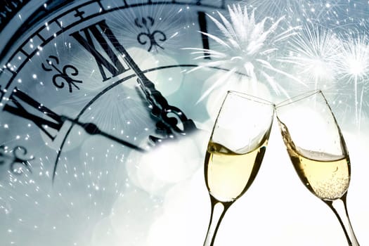 Glasses with champagne against fireworks and clock close to midnight