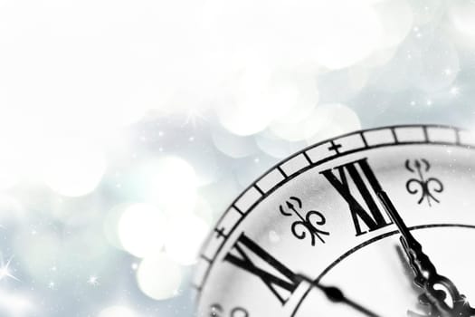 New Year's at midnight, clock on silver background
