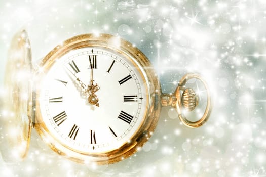 New Year's at midnight - Old golden clock with stars and snowflakes
