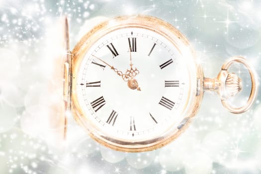 New Year's at midnight - Old golden clock with stars and snowflakes on the background