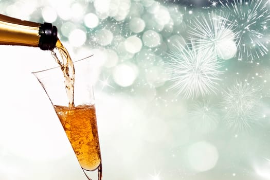 Glasses with champagne against fireworks