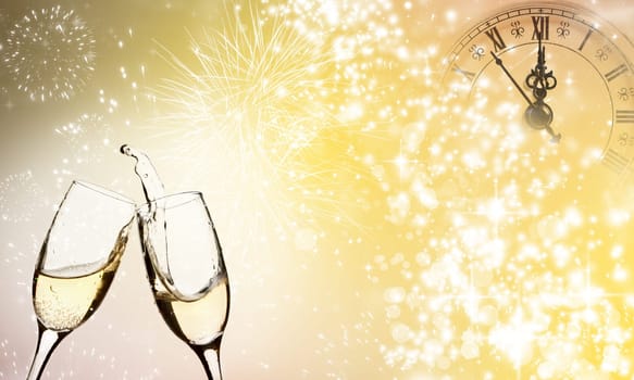Glasses with champagne against fireworks close to midnight