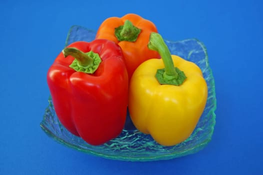 Red, orange and yellow peppers variety. Vegetables background.