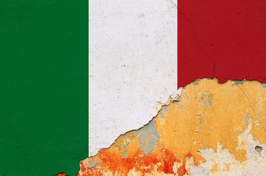 Italian flag painted on cracked smudged wall. Chipped paint grunge background.