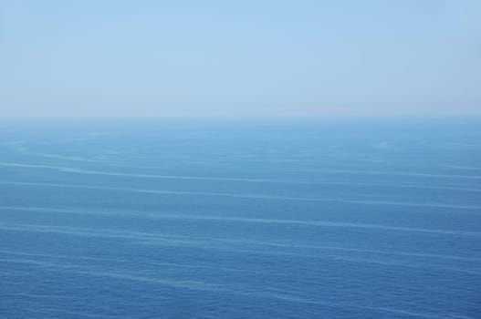 Ocean currents deep sea water and sky horizon. Nature background.