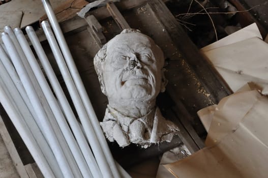 Broken sculpture head of adult man among debris in the abandoned studio of sculptor Nikolaos Pavlopoulos, Athens Greece, February 3, 2012.