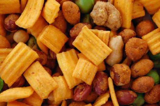 Spicy dried nuts salty snacks mix. Food background.