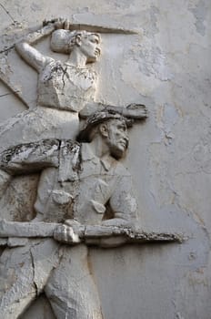 Entablature of soldier and ancient victory goddess Nike architectural detail on weathered wall exterior at the abandoned house of sculptor Nikolaos Pavlopoulos in Athens Greece, February 3, 2012.