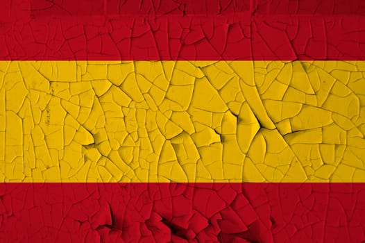 Spanish national flag on peeling paint wall. Weathered grunge background.