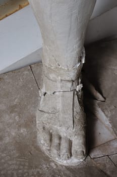 Broken plaster statue foot detail in the abandoned studio of sculptor Nikolaos Pavlopoulos, Athens Greece, February 3, 2012.
