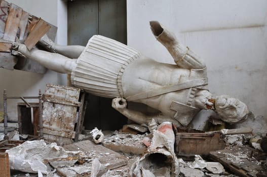 Broken statue gigantic figure ancient god in the abandoned vandalized studio of sculptor Nikolaos Pavlopoulos in Athens Greece, February 3, 2012.
