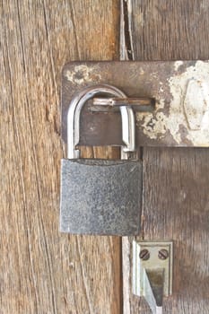 old padlock on an old wooden door