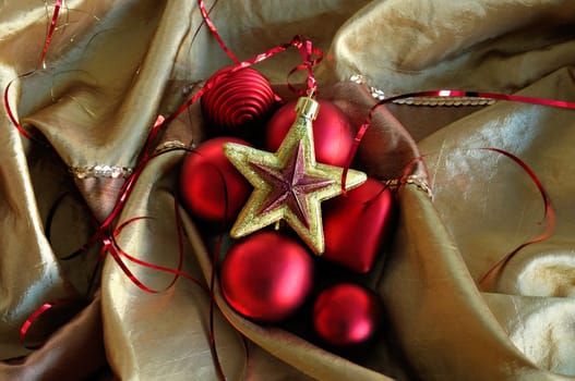 Christmas baubles, red heart and golden star. Seasonal background.