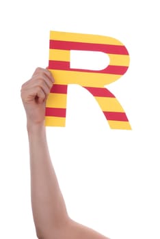 A Hand Holding a Colorful R, Isolated