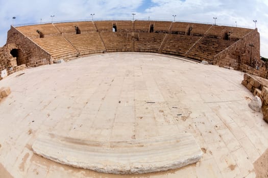 Fisheye view of an ancient Roman amphitheater in Caesarea in Israel