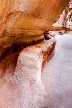 Ancient water channel carved in the walls of Siq in Petra, Jordan
