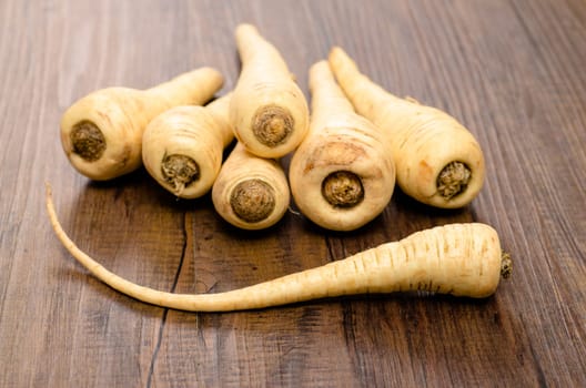 A stack of vegetable parsnips on a table