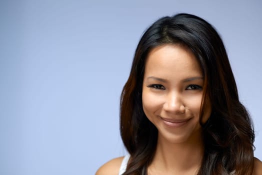 Young people, female teenager, woman, beauty and body care, portrait of happy Asian girl smiling in studio on gray background, copy space