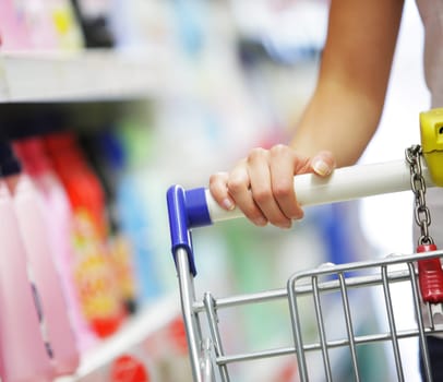 Woman with shopping cart, close up