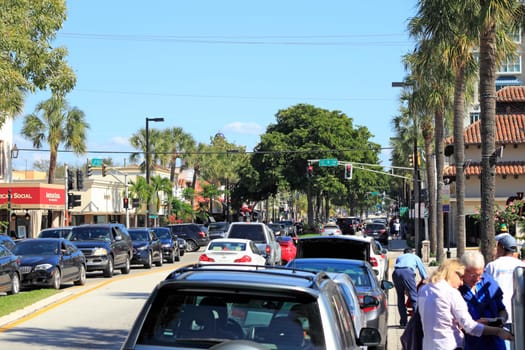 FORT LAUDERDALE, FLORIDA - FEBRUARY 3, 2013: Sunday finds shoppers shopping on very popular and busy Las Olas Boulevard near downtown with car and foot traffic at various stores and restaurants.