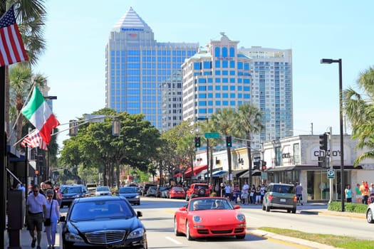 FORT LAUDERDALE, FLORIDA - FEBRUARY 3, 2013:  Las Olas Boulevard shoppers drive and walk to visit stores, upscale shops and eateries in the downtown neighborhood.