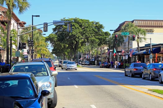 FORT LAUDERDALE, FLORIDA - FEBRUARY 3, 2013: People stroll about and shop at various Las Olas Boulevard stores and restaurants on a busy and sunny weekend winter day in a beautiful urban setting.