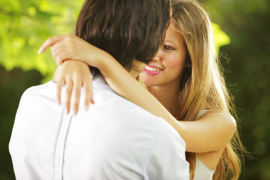 a young couple in love having a romantic moment in the park