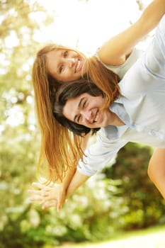 a young couple in love having fun in the park