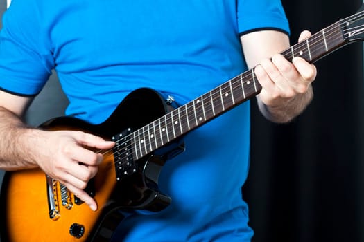 Man exercising on guitar