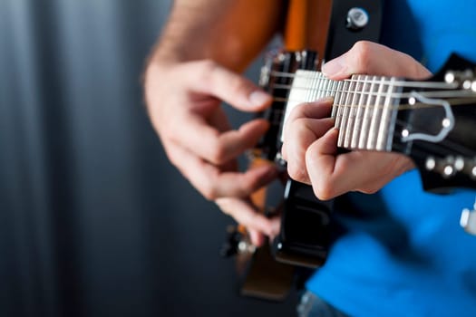 Man exercising on guitar