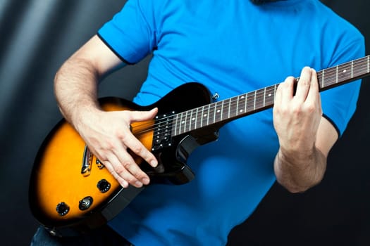 Man exercising on guitar