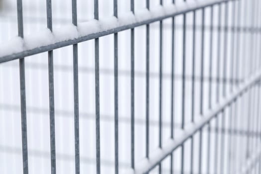 Iron grid background in winter